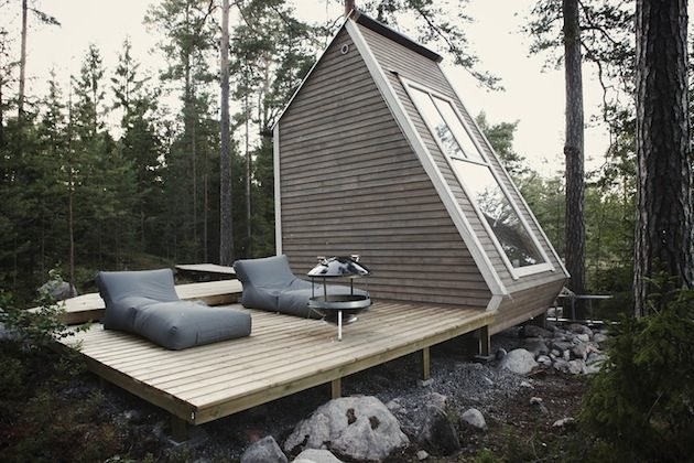 A-frame cabin with deck in pine forest