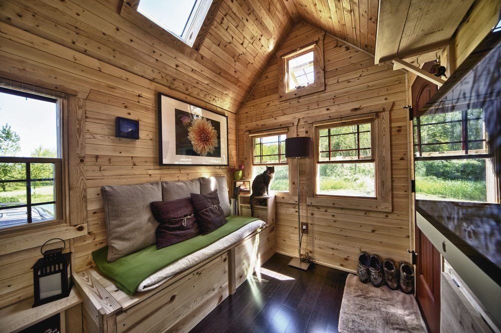 Warm pine interior with vaulted ceiling and loft ladder