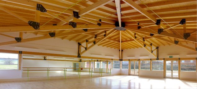 Empty light-filled hall ready for ceremony, yoga, and dance