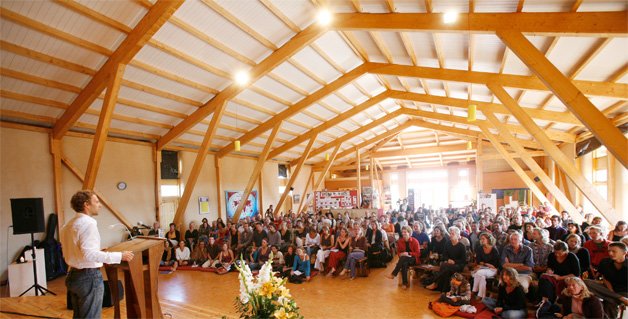 Community gathering in a timber-roofed hall
