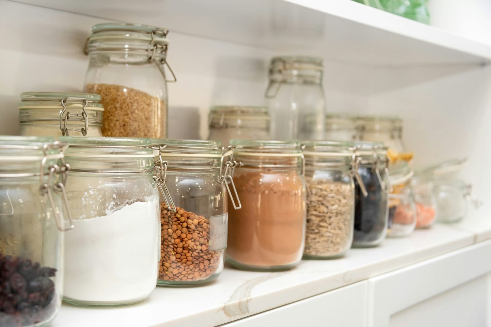 Pantry shelves with Kilner jars of grains and pulses
