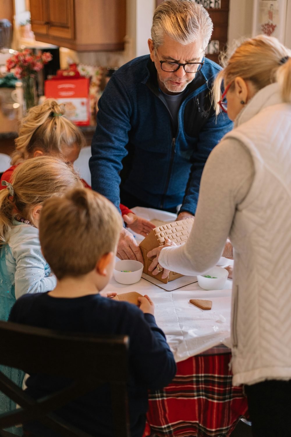 Hands laid along a tree trunk — community and connection to the natural world