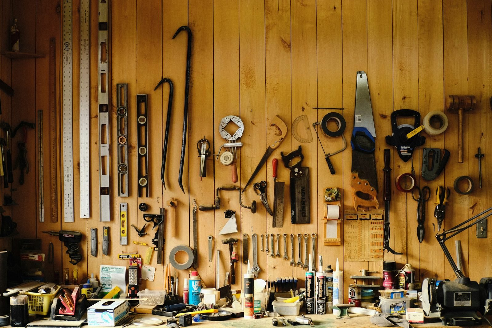 Metalwork workshop with copper bells and hand tools