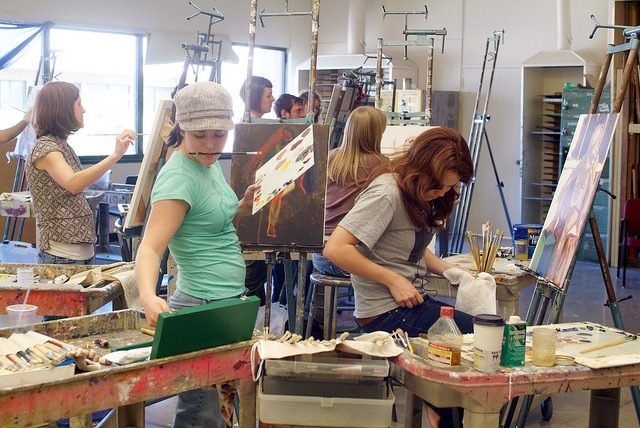 Painting class in progress, people at easels