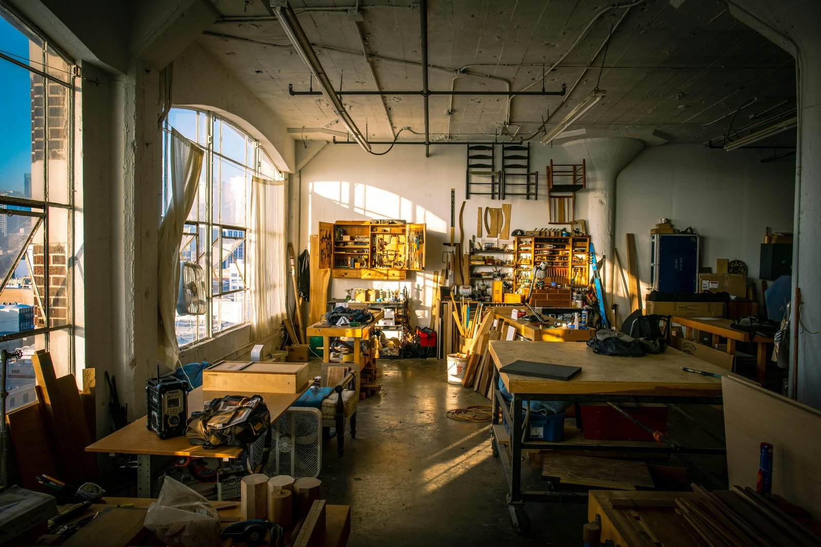Workshop wall covered with tools, saws and spanners