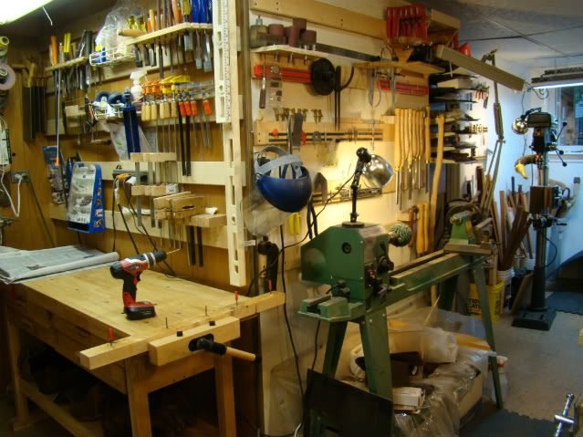 Traditional woodworking shop with tools on walls